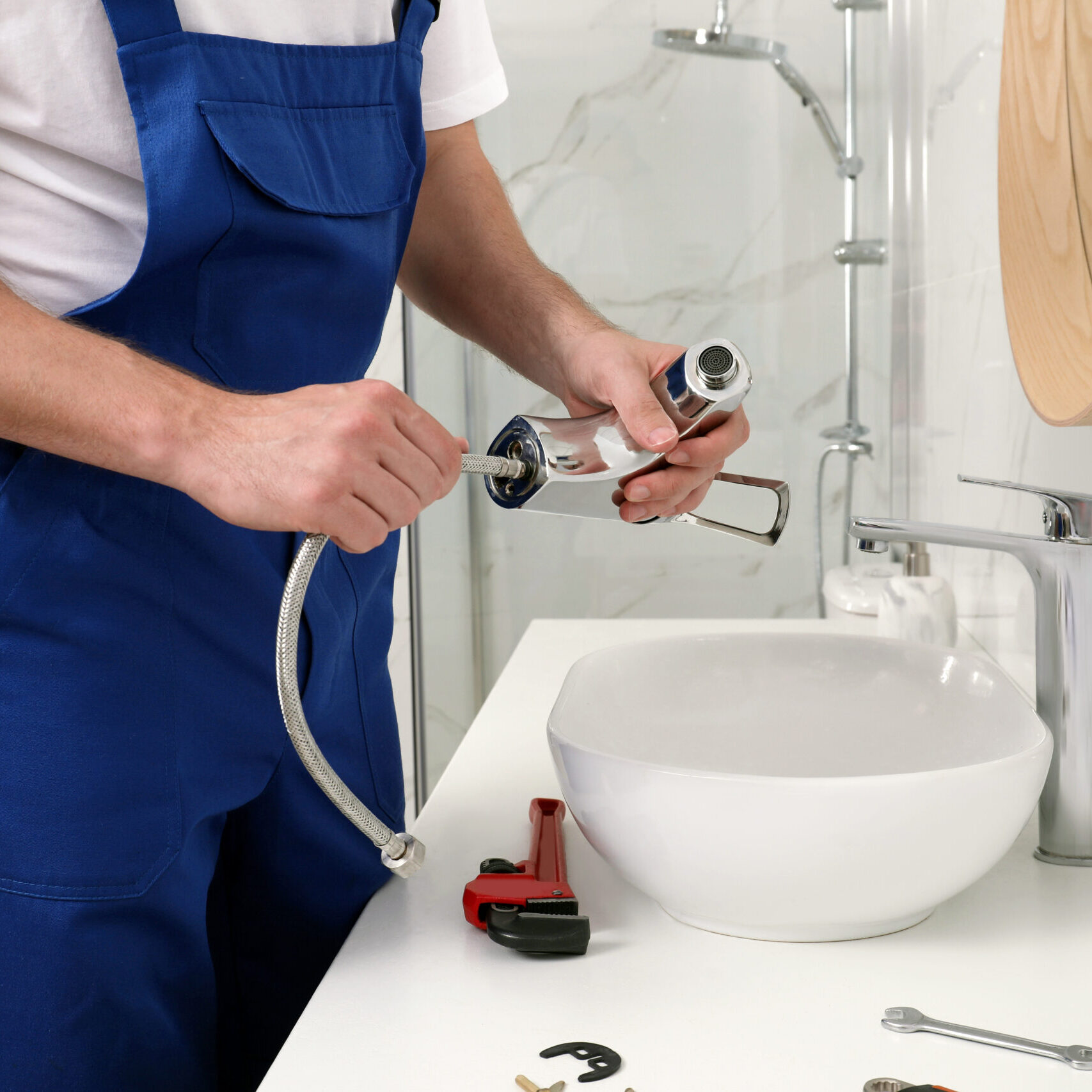 Professional,Plumber,Fixing,Water,Tap,In,Bathroom,,Closeup
